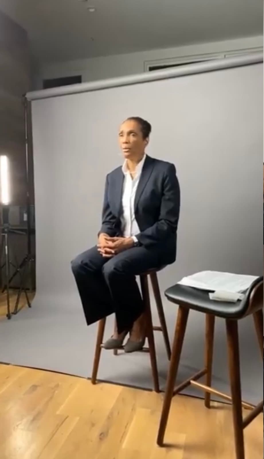 Directing the testimonial on a clean studio backdrop.